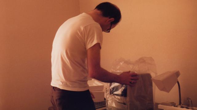 Bryce Wray, in 1984, unwrapping his new Macintosh computer
