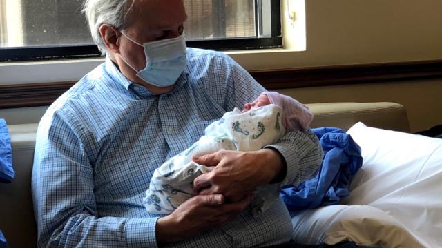 Bryce Wray holds his grandson, Dylan Everett Beck, shortly after the child’s birth